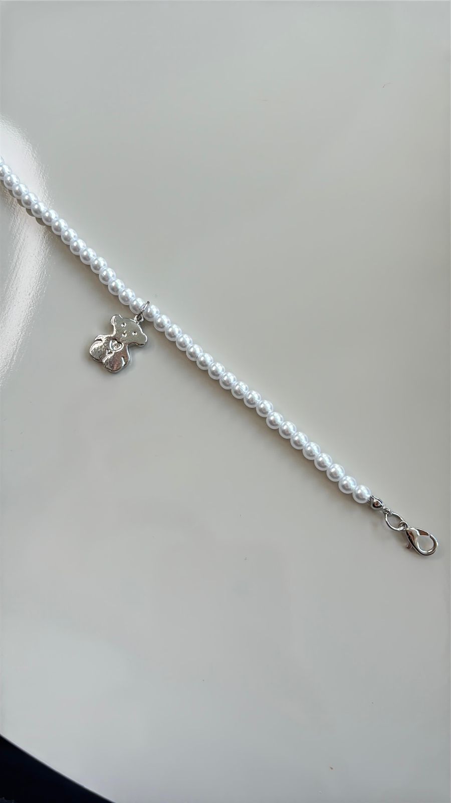 pulseira pérola com pingente de ursinho prata