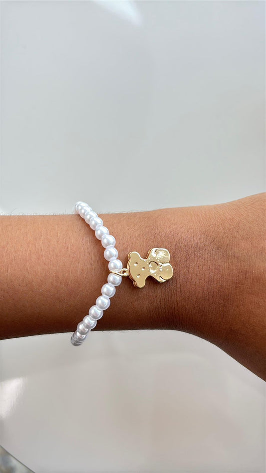 pulseira pérola com pingente de ursinho dourado