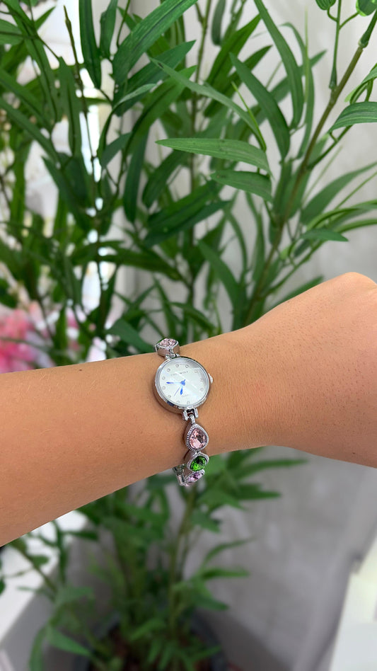 relógio prata com cinza e detalhes em pedraria colorida